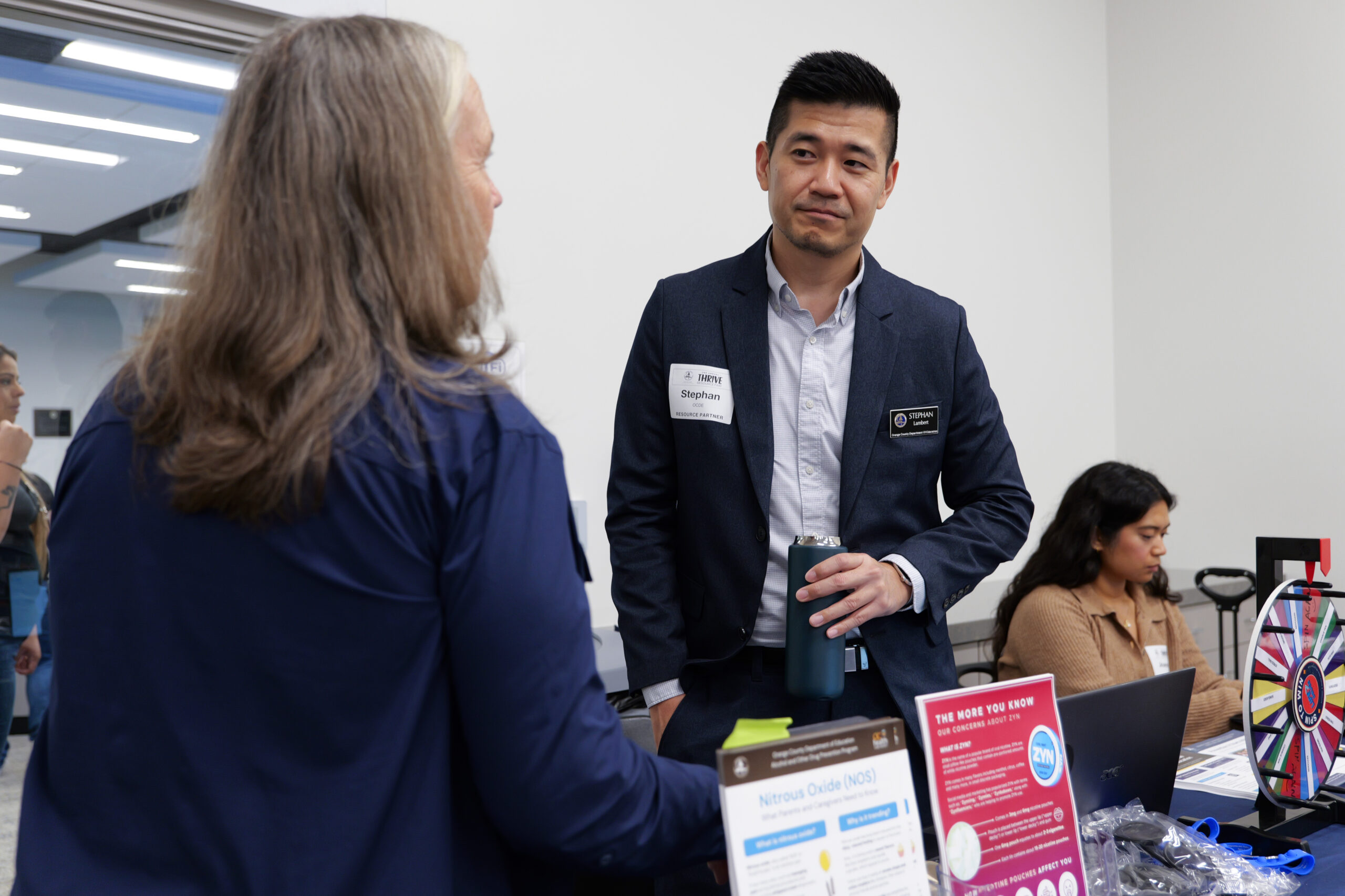 OCDE Prevention Education Coordinator Stephan Lambert speaks with an attendee during the department’s Thrive Resource Fair on Sept. 25, 2025, at the OCDE Conference Center in Costa Mesa.