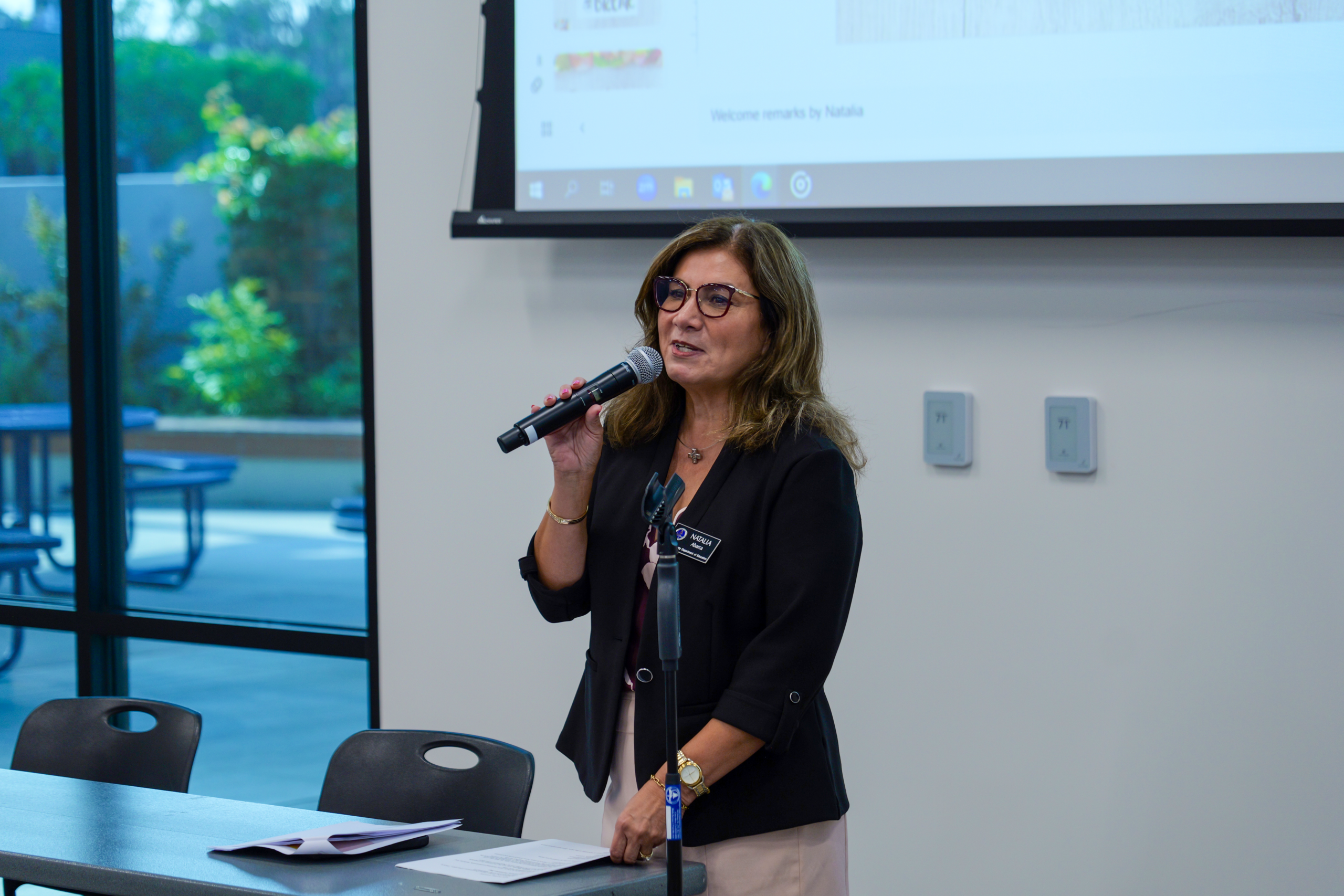 OCDE Language Services Coordinator Natalia Abarca welcomes attendees to the department’s 2025 International Translation Day celebration at the OCDE Conference Center.