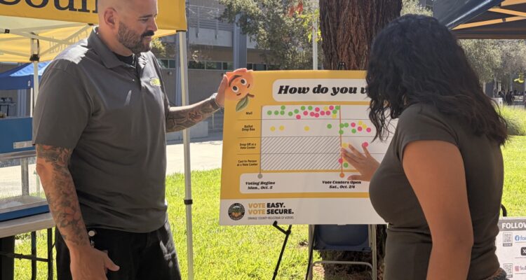 Representatives from the Orange County Registrar of Voters share information about voting options during an outreach event at Santiago Canyon College in Orange.