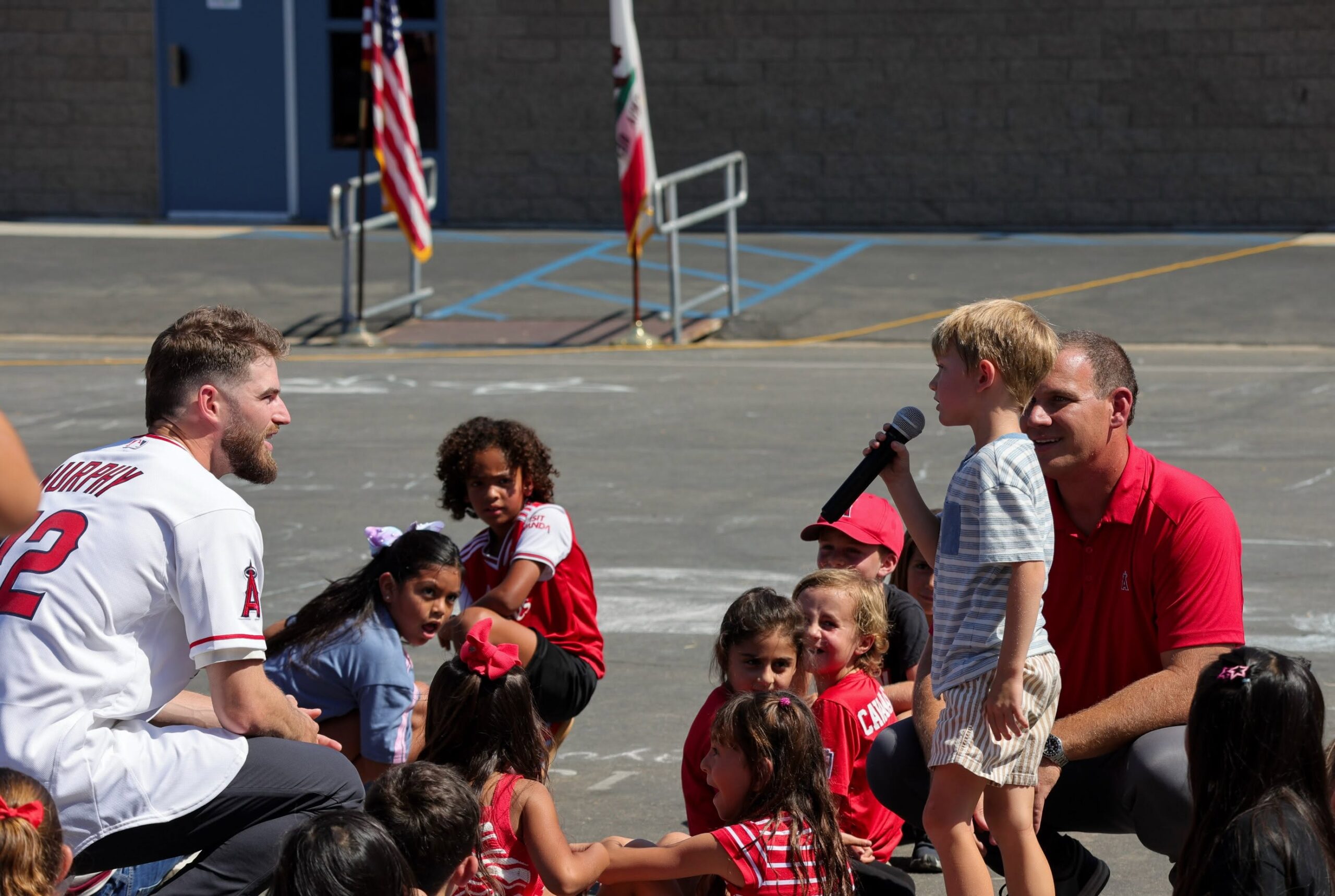 Angels pitcher Luke Murphy and broadcaster Trent Rush answer questions from Lomarena Elementary students at the schoolwide Classroom Connections assembly. (Courtesy of Angels Baseball Foundation)