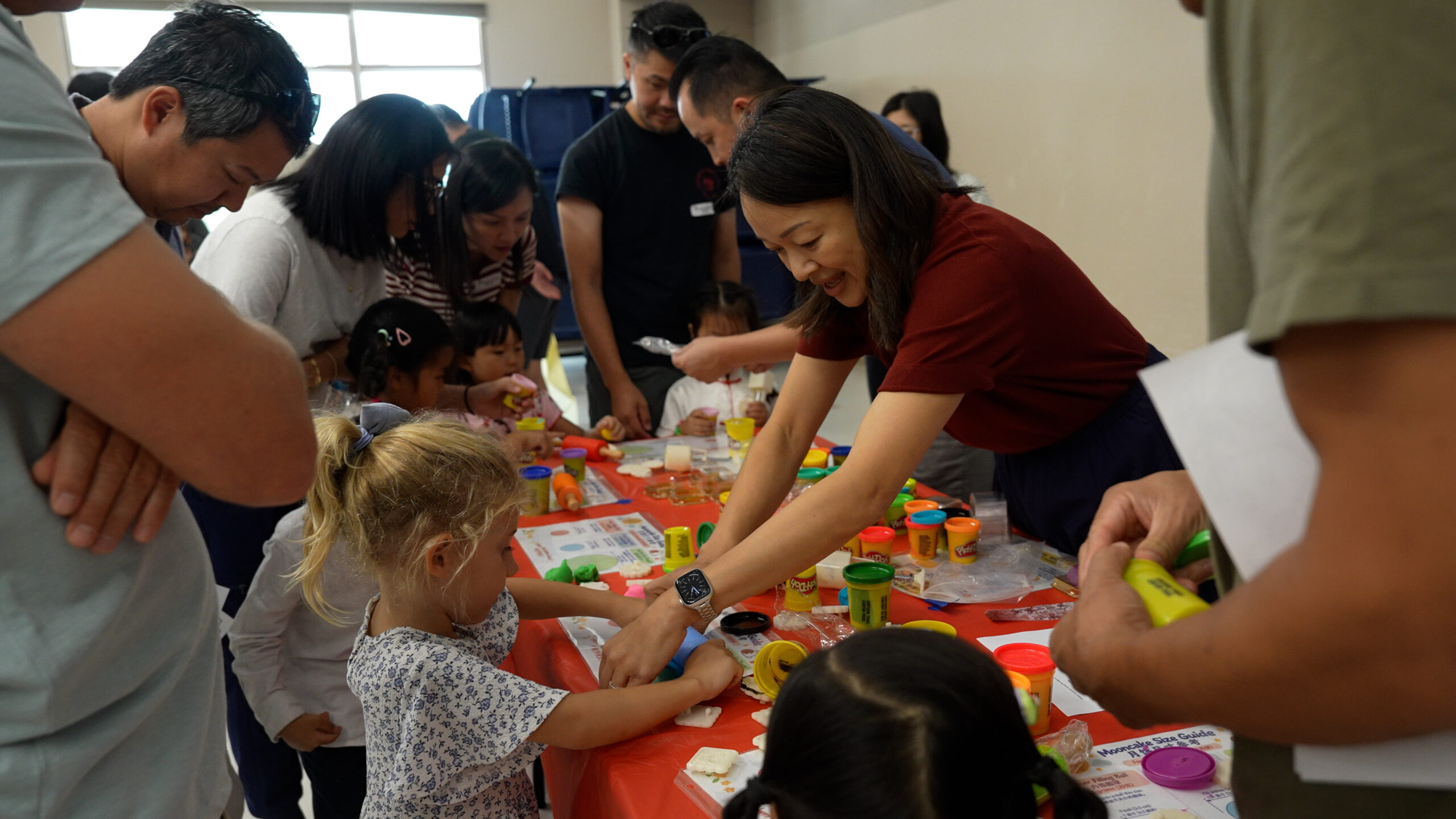 Students and families take part in a hands-on activity using Play-Doh during Hicks Canyon Elementary School's Mid-Autumn Festival celebration, an event highlighting the connection between language learning and cultural traditions. (Photo courtesy of the Tustin Unified School District)