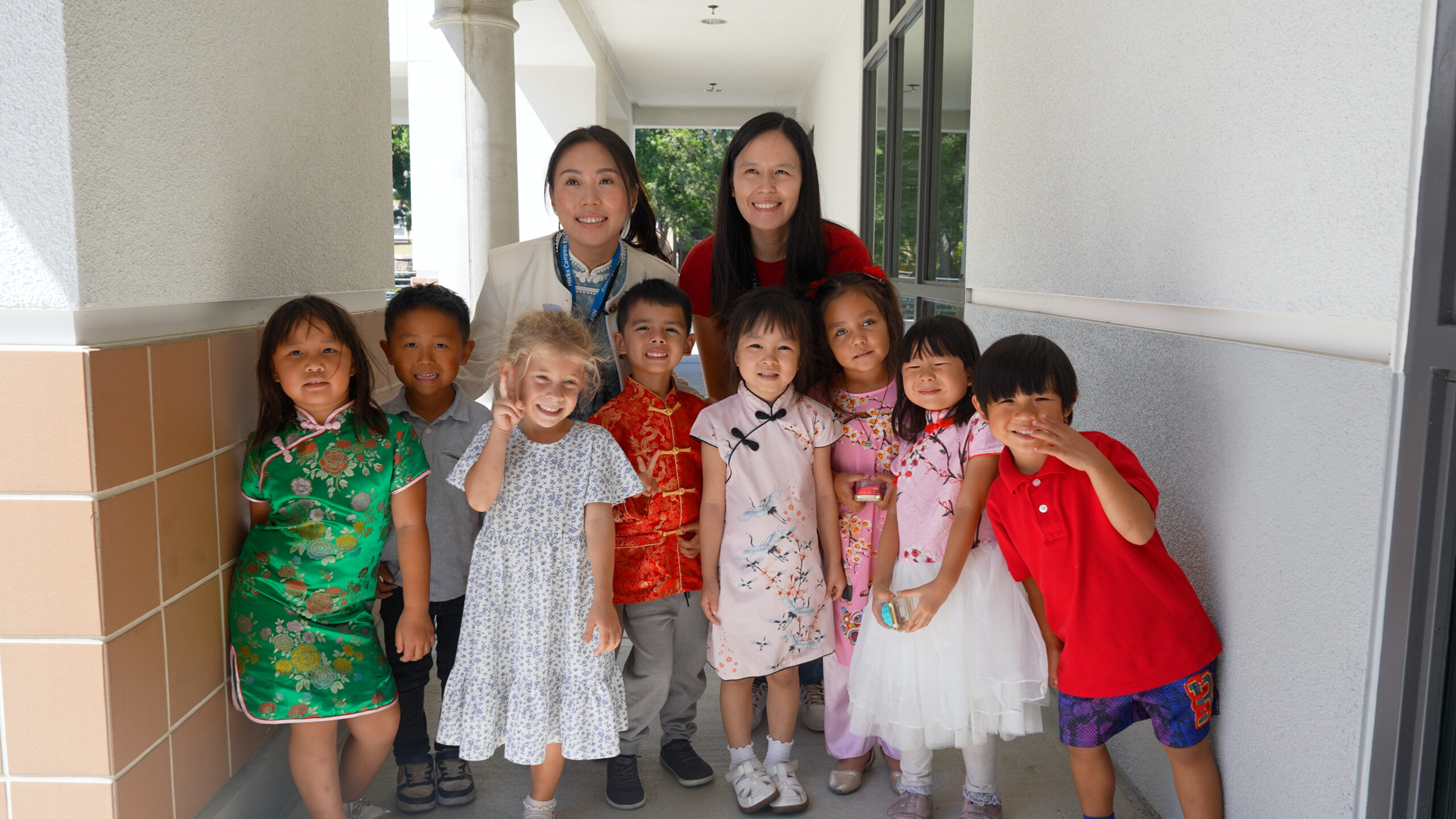 Students in Hicks Canyon Elementary School's Mandarin Immersion Program pose with educators during the school's Mid-Autumn Festival celebration. Several children wore traditional Chinese-inspired clothing for the occasion. (Photo courtesy of the Tustin Unified School District)