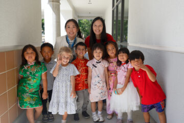 Students in Hicks Canyon Elementary School's Mandarin Immersion Program pose with educators during the school's Mid-Autumn Festival celebration. Several children wore traditional Chinese-inspired clothing for the occasion. (Photo courtesy of the Tustin Unified School District)