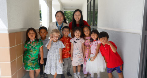 Students in Hicks Canyon Elementary School's Mandarin Immersion Program pose with educators during the school's Mid-Autumn Festival celebration. Several children wore traditional Chinese-inspired clothing for the occasion. (Photo courtesy of the Tustin Unified School District)