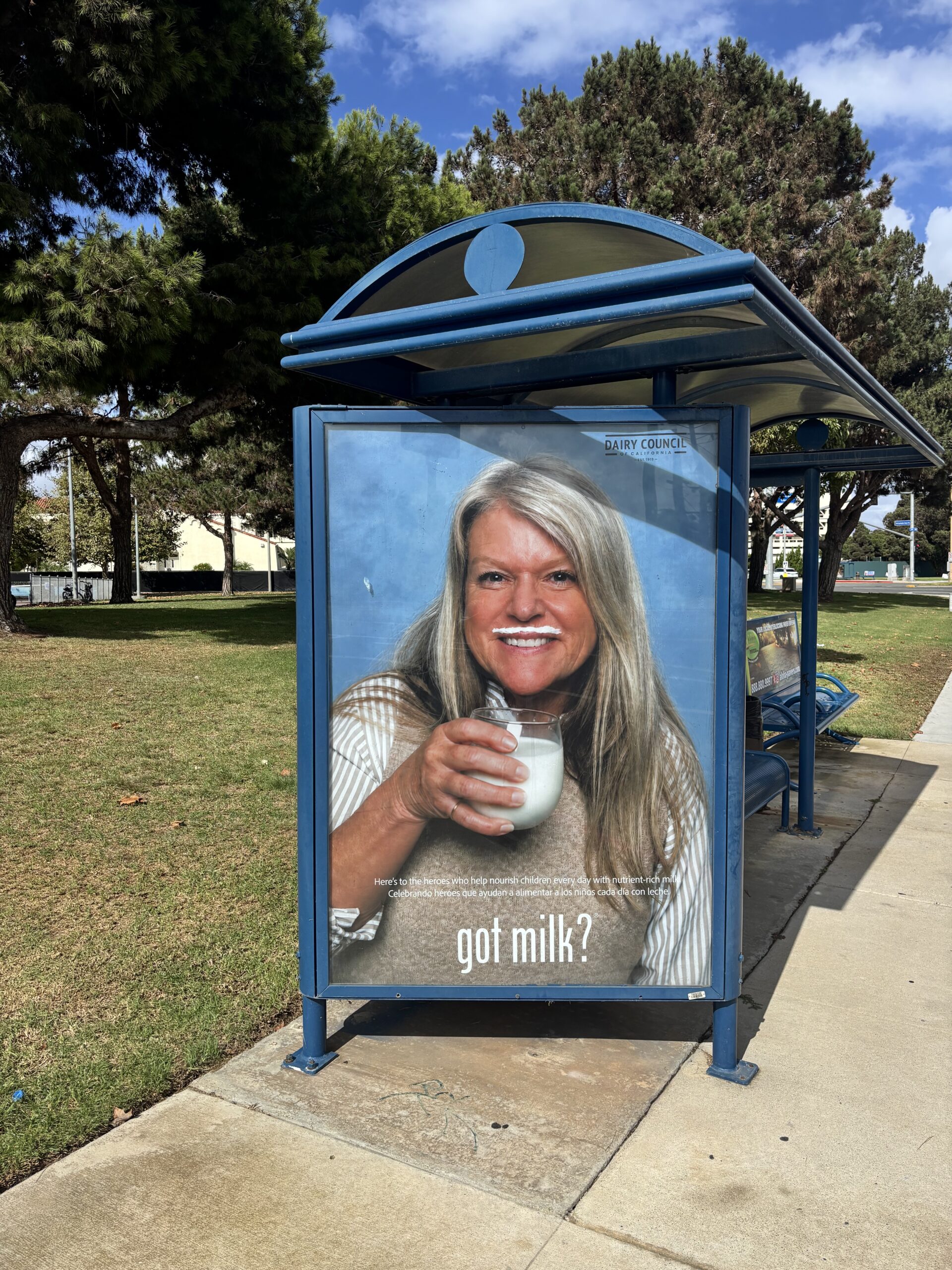 Melissa Erman, operations supervisor for Huntington Beach Union High School District's Nutrition Services team, appears in a Got Milk? advertisement displayed at a bus stop in Huntington Beach. She is one of five district employees featured in the campaign.