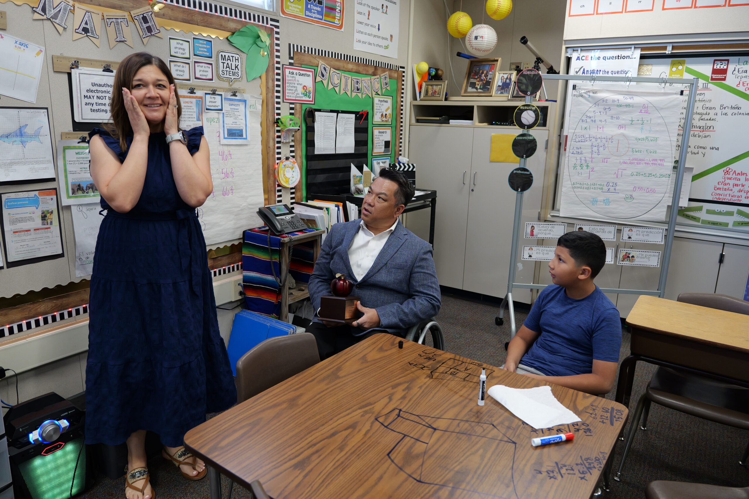 Wendy Saldivar, a fifth-grade teacher at Loara Elementary School in Anaheim, reacts as Orange County Superintendent of Schools Dr. Stefan Bean surprises her with the news that she has been named a 2027 Orange County Teacher of the Year in April.