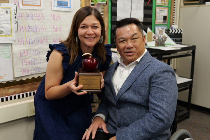 Wendy Saldivar poses with Orange County Superintendent of Schools Dr. Stefan Bean after receiving her 2027 Orange County Teacher of the Year award during a surprise classroom visit in April.