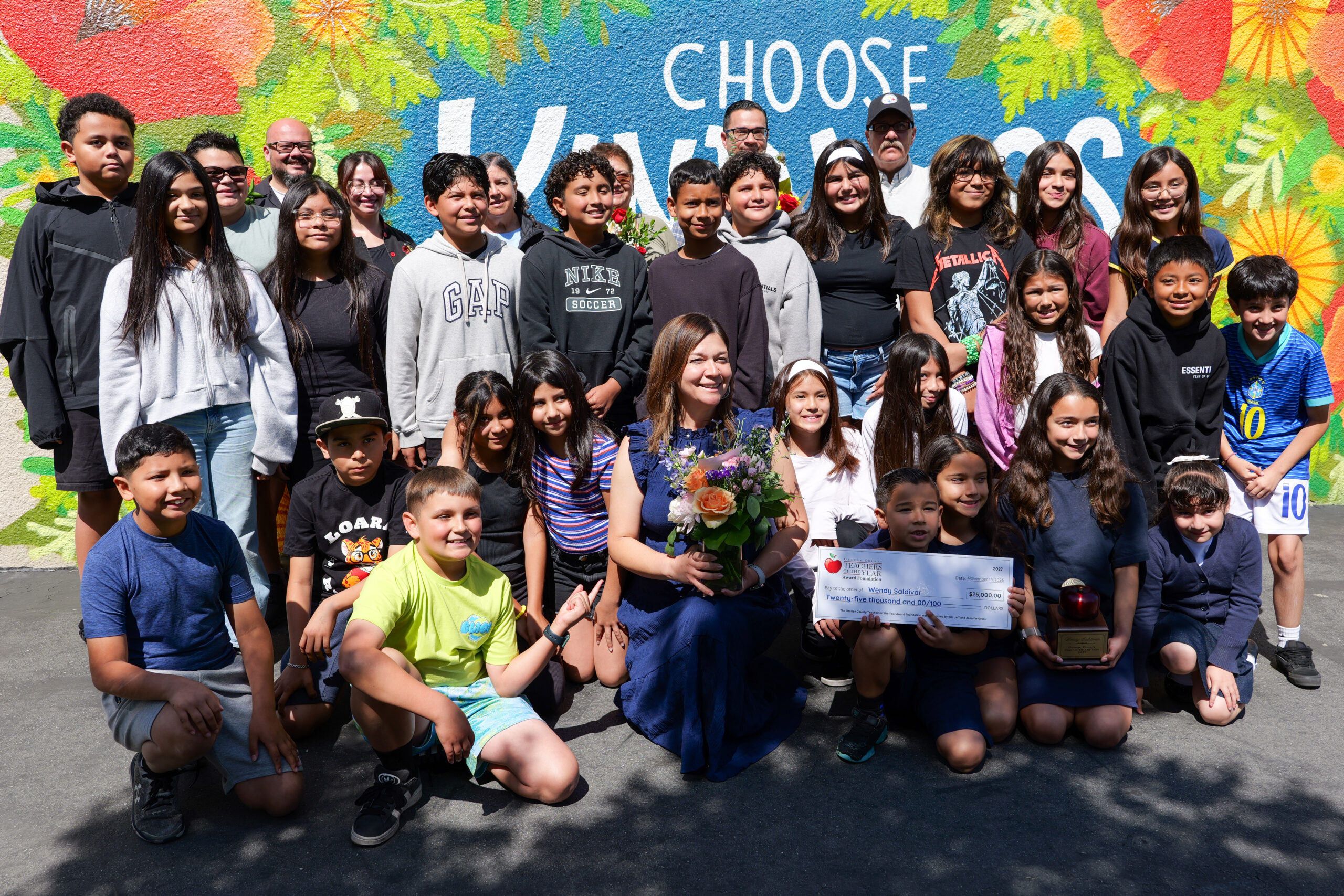 Wendy Saldivar, center, celebrates with her students and family members outside Loara Elementary School after being named a 2027 Orange County Teacher of the Year in April.