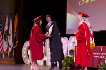 College and Career Preparatory Academy student Samantha A. takes the stage to accept her Perseverance Award at the June 16 graduation ceremony.