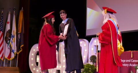 College and Career Preparatory Academy student Samantha A. takes the stage to accept her Perseverance Award at the June 16 graduation ceremony.