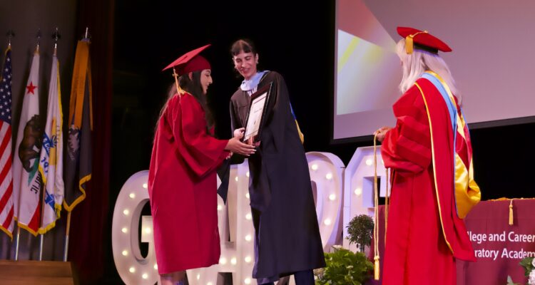 College and Career Preparatory Academy student Samantha A. takes the stage to accept her Perseverance Award at the June 16 graduation ceremony.