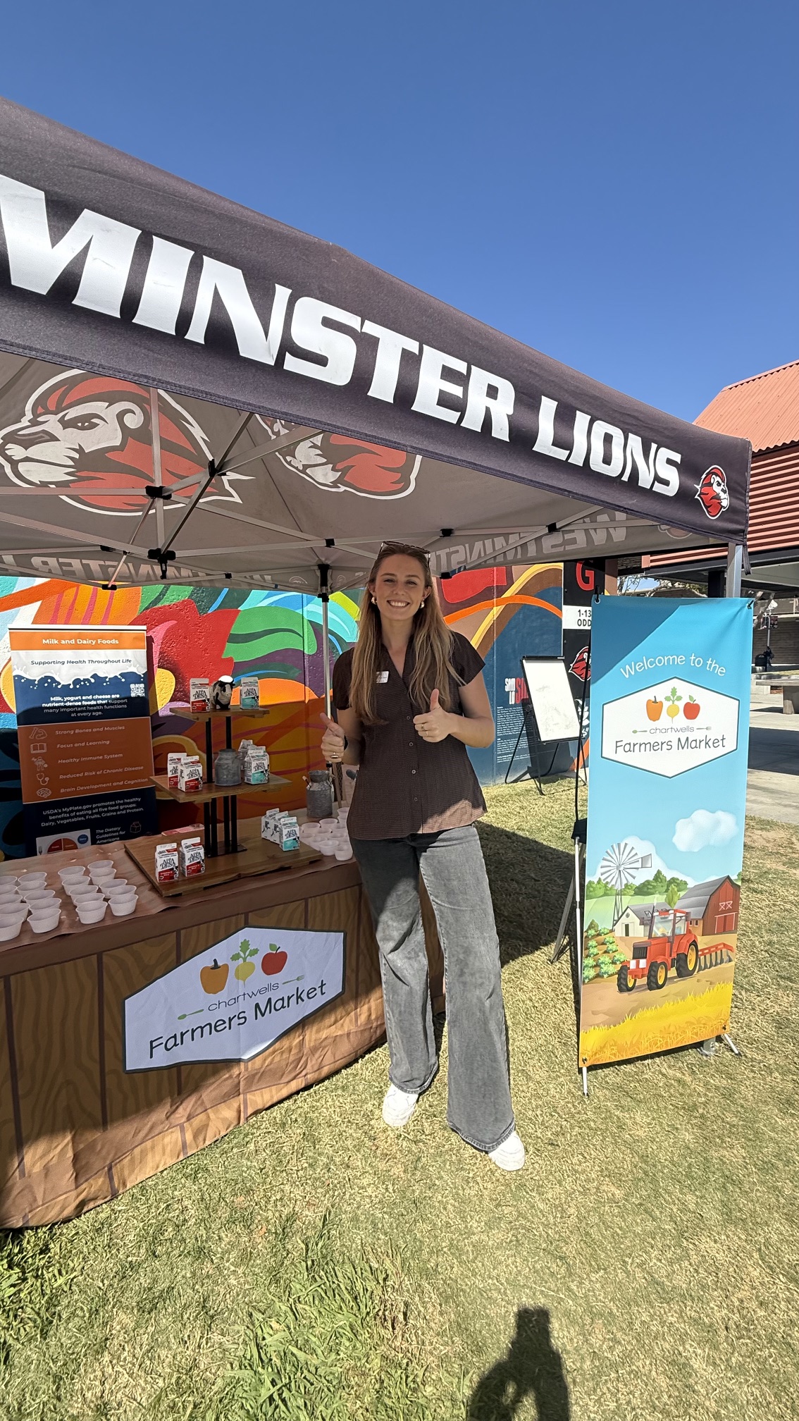 A participant gives a thumbs-up at a milk tasting station during World School Milk Day festivities Sept. 30 at Westminster High School. The event, organized in partnership with the Dairy Council of California, featured milk tastings, student voting and nutrition education activities.