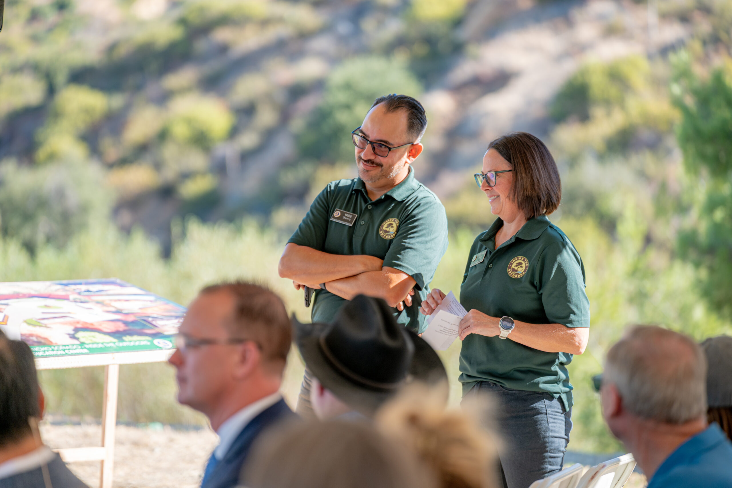 Inside the Outdoors Outreach Manager Yarib Dheming, left, and Operations Manager Stephanie Smith listen during the Oct. 6 groundbreaking ceremony at Rancho Soñado.